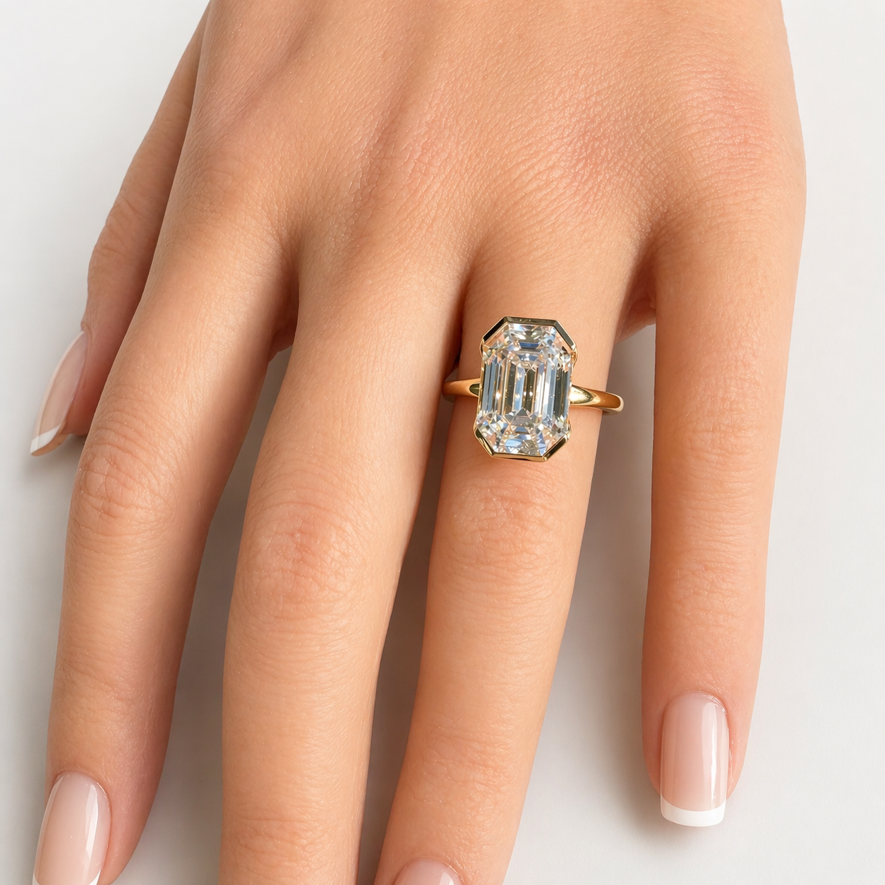 The Half Step 6ct Emerald Cut Solitaire in 14K Yellow Gold