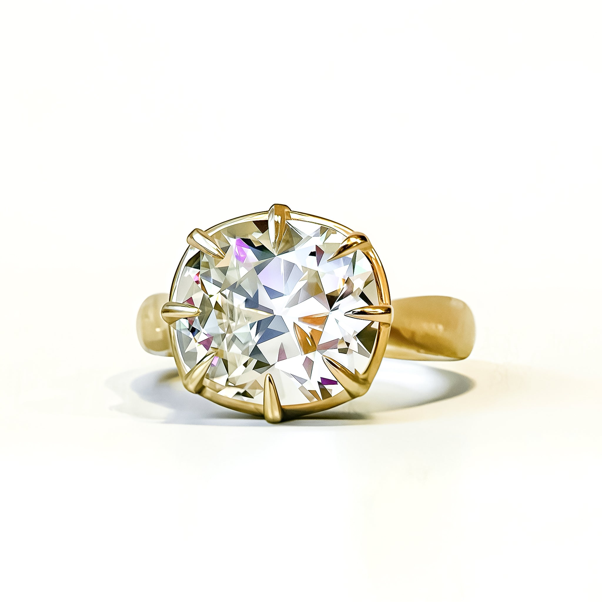 OId mine cut cushion in chunky collet setting, 14K yellow gold