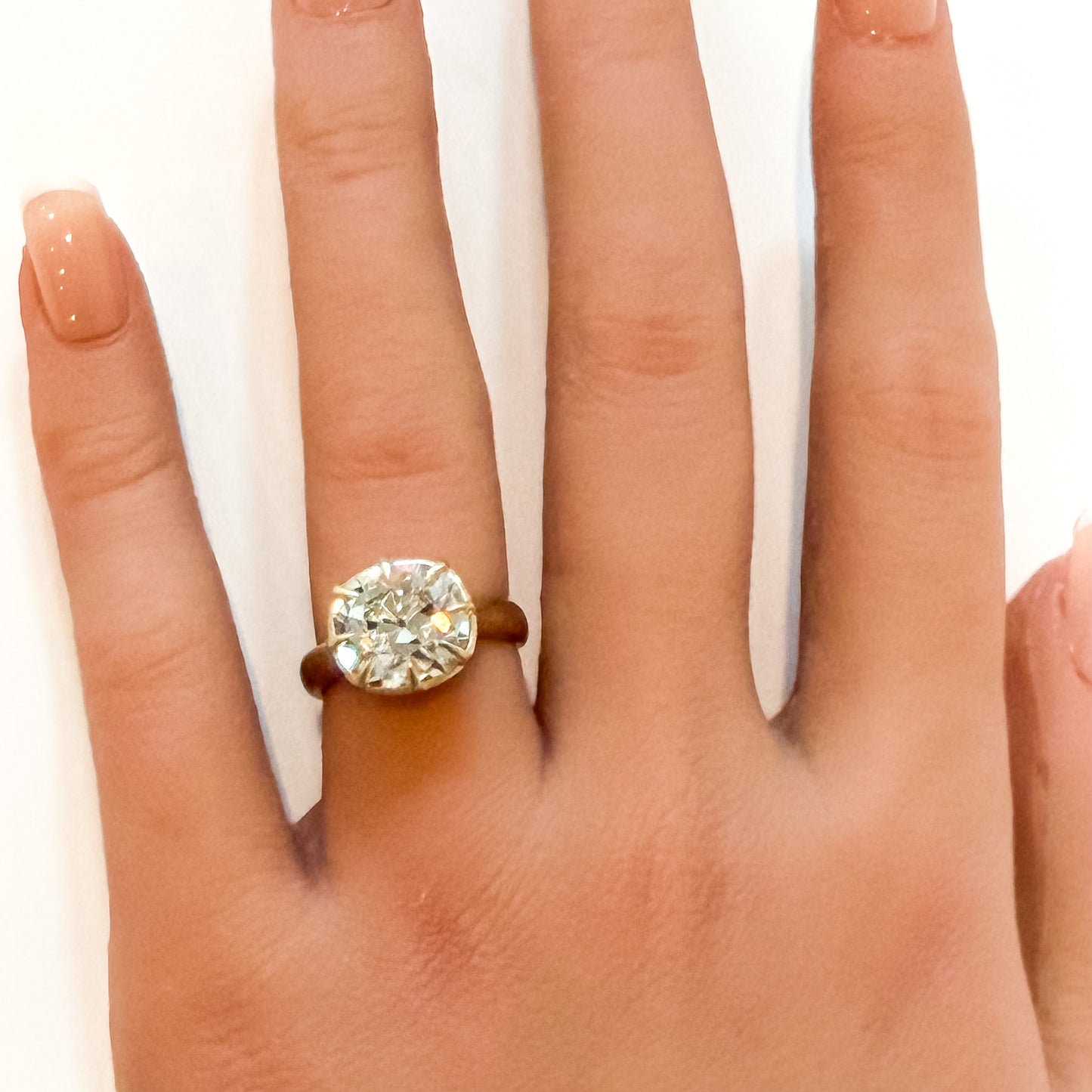 OId mine cut cushion in chunky collet setting, 14K yellow gold