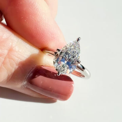 Compass Set Antique Cut Pear Diamond Ring in Platinum