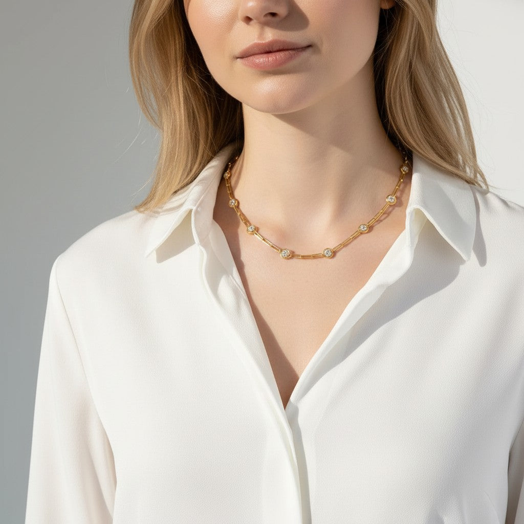 Soriano Custom 14K yellow gold paperclip necklace featuring 15 bezel-set round brilliant diamonds on a model.